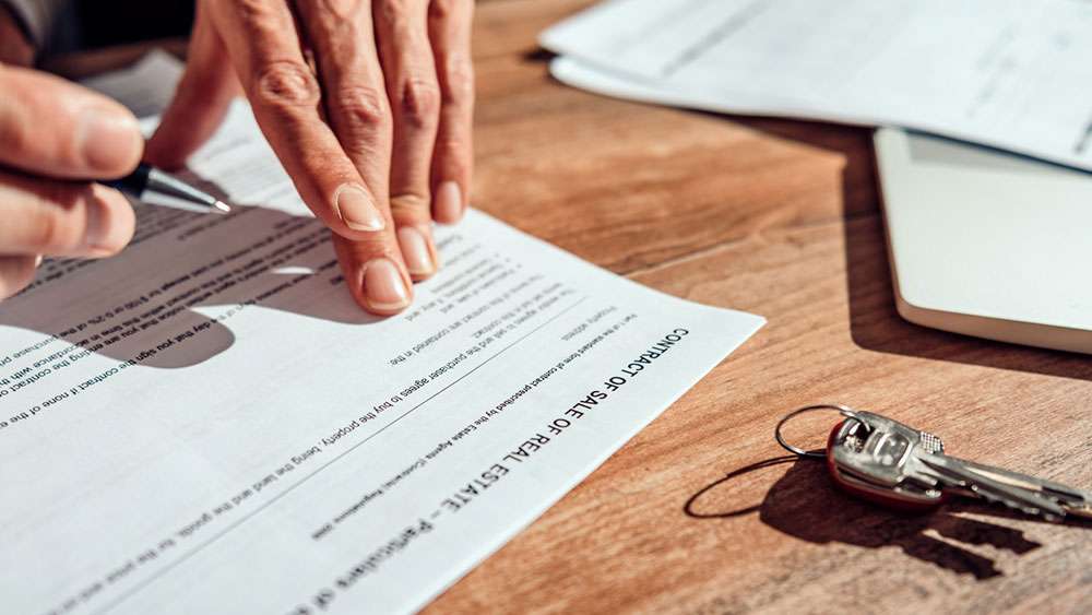 Homebuyer signs the real estate contract